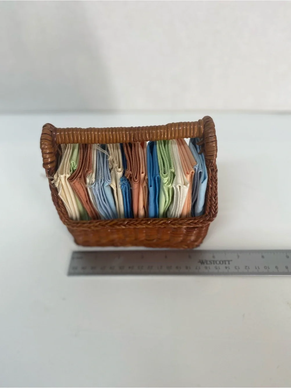 Wicker Basket Woven Rattan with Assorted Pastel Linens Cloths Storage Dainty